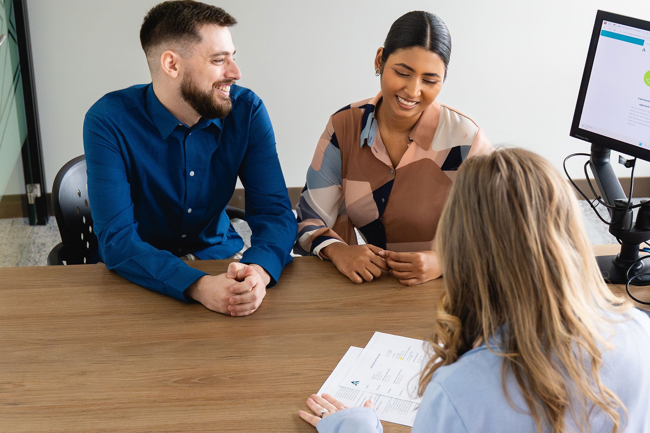 People speaking to their wealth advisor